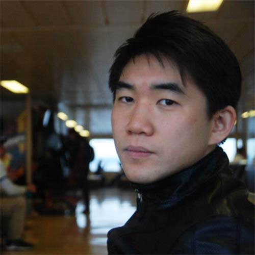 Young asian man wears a black jacket and scarf